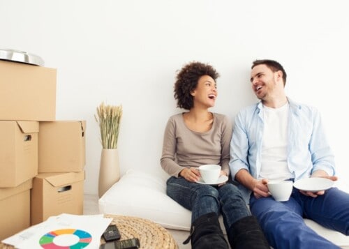 man and woman laughing in rental apartment