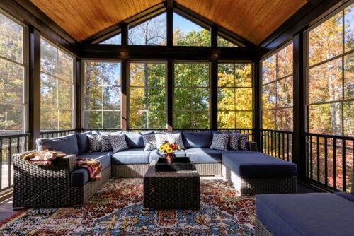 Interior view of beautiful sunroom overlooking a wooded area - how to write a real estate listing description