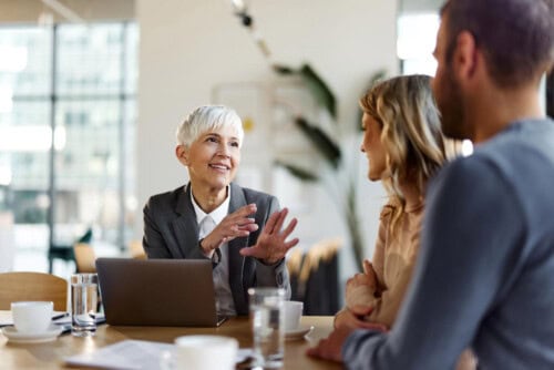 real estate agent negotiates with clients