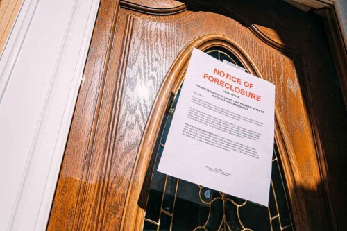 Wooden door with foreclosure notice – when is it too late to stop foreclosure